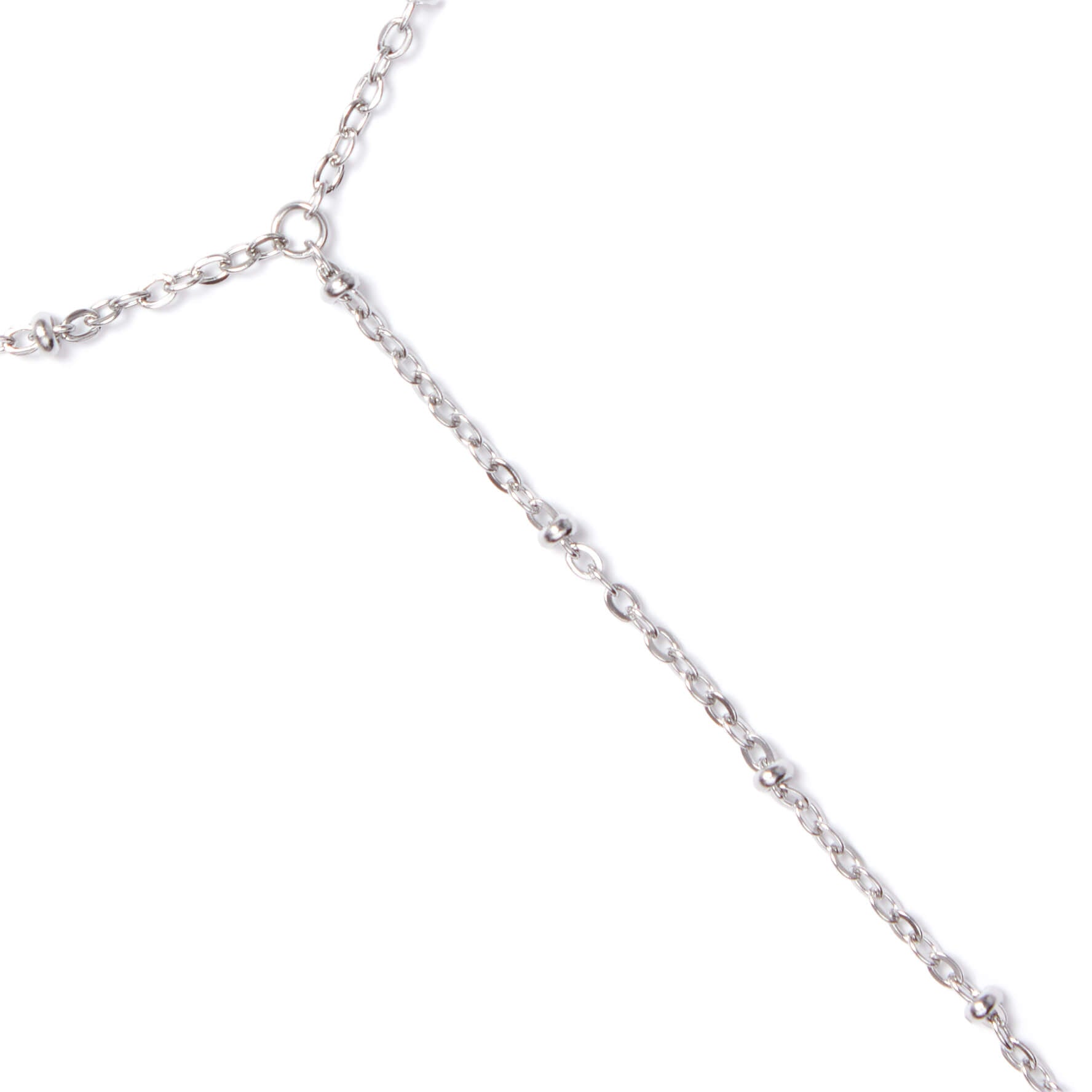 Close-up of a silver chain on a white background
