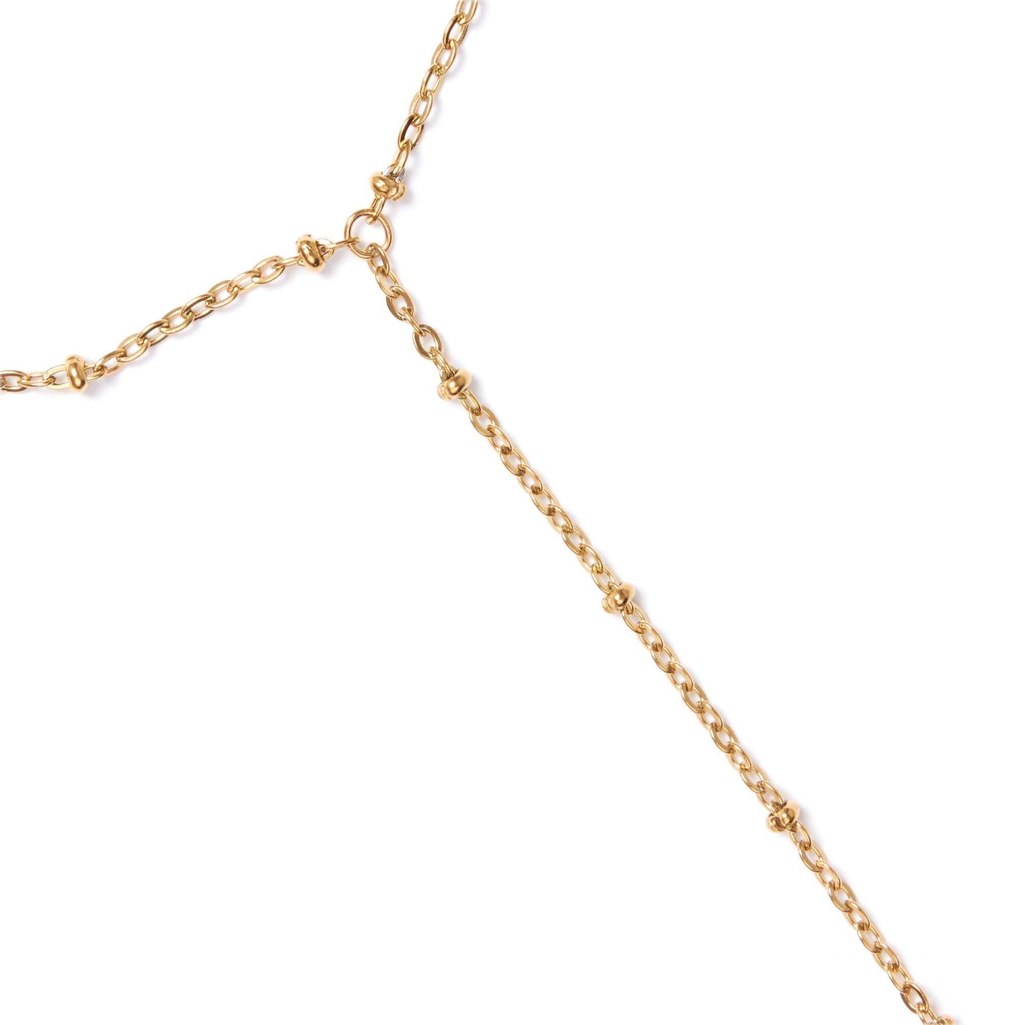 Gold hand chain close up on a white background
