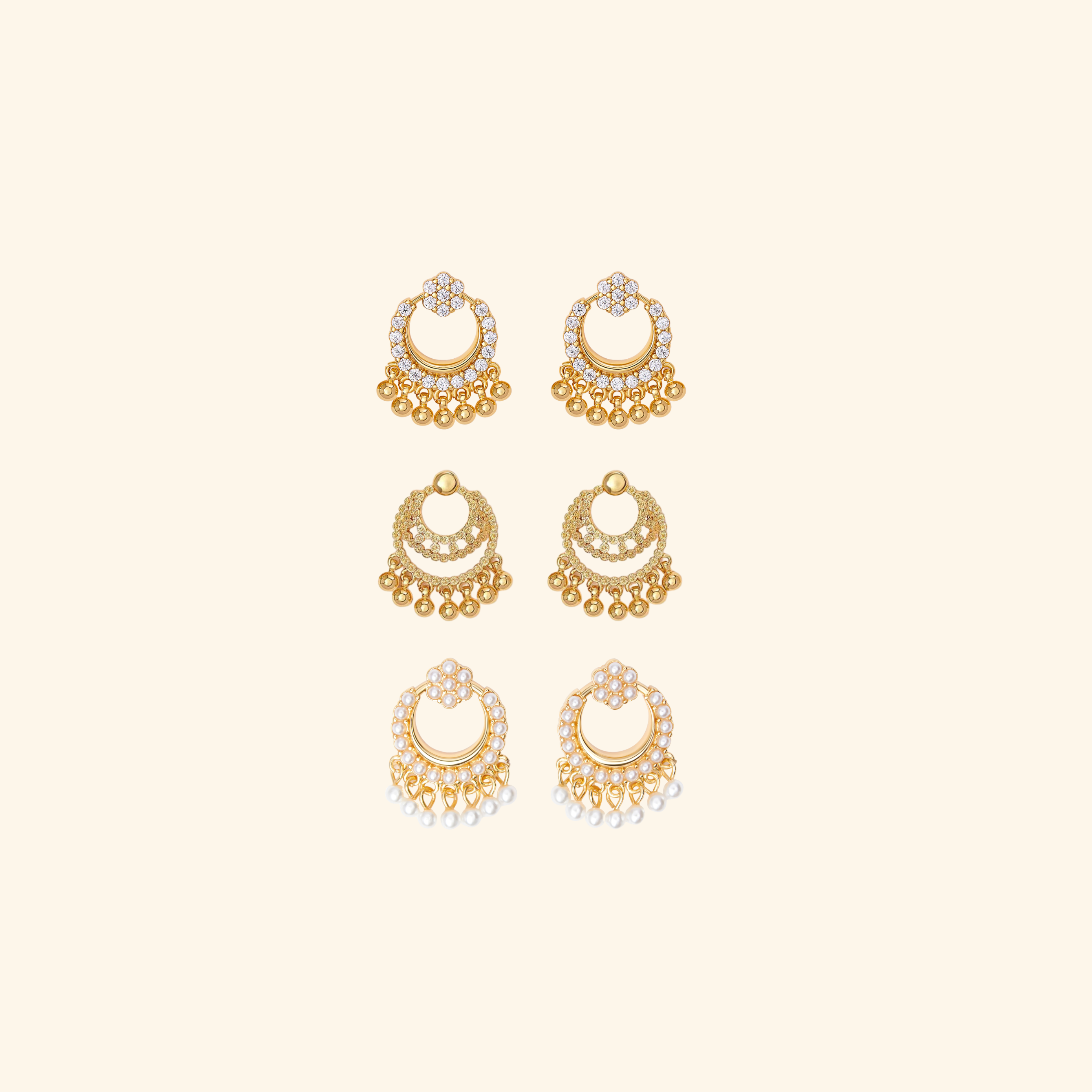Set of gold earrings on a beige background