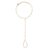 Gold chain lariat handchain on a white background