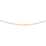 A gold-colored beaded necklace with minimalist chain design.