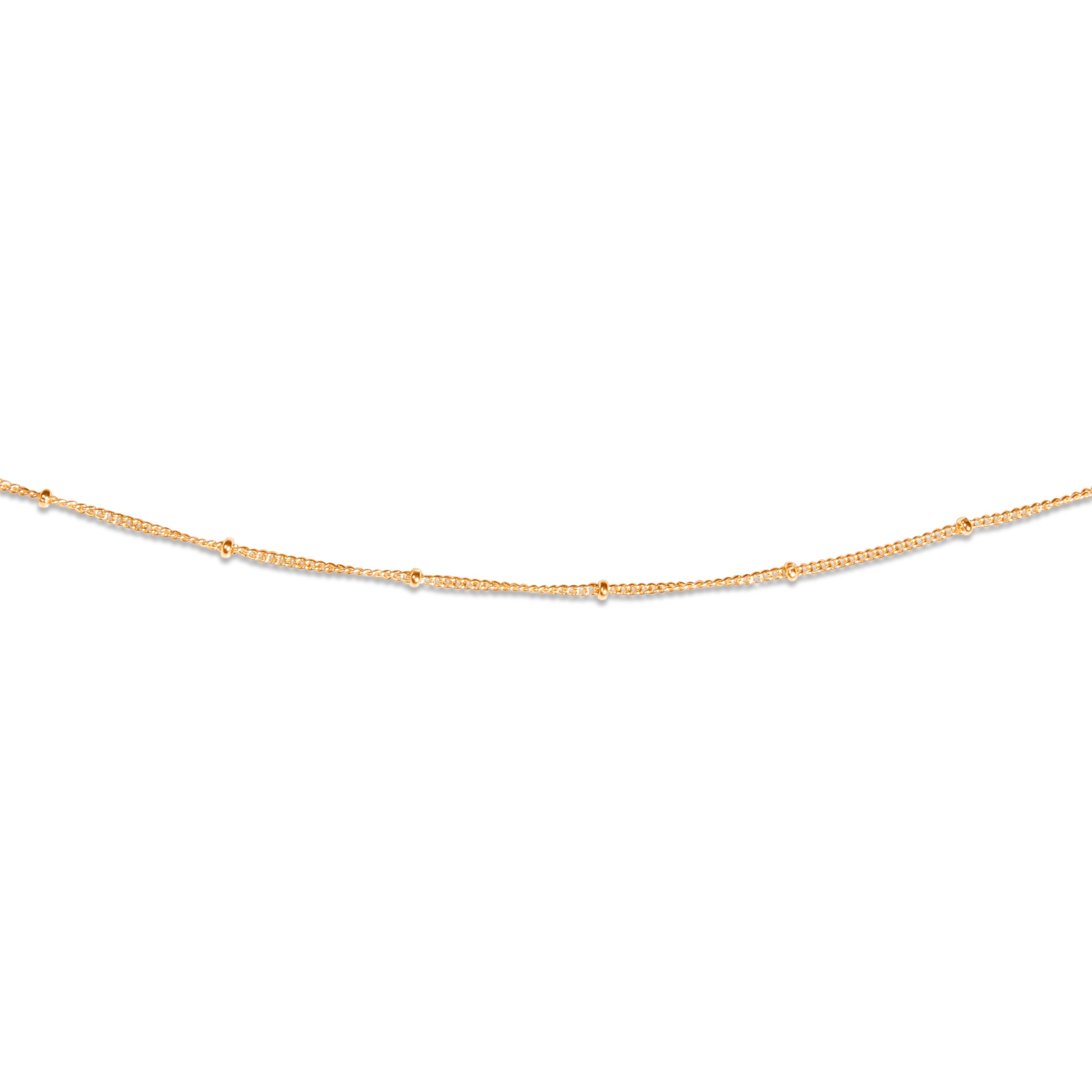 A gold-colored beaded necklace with minimalist chain design.